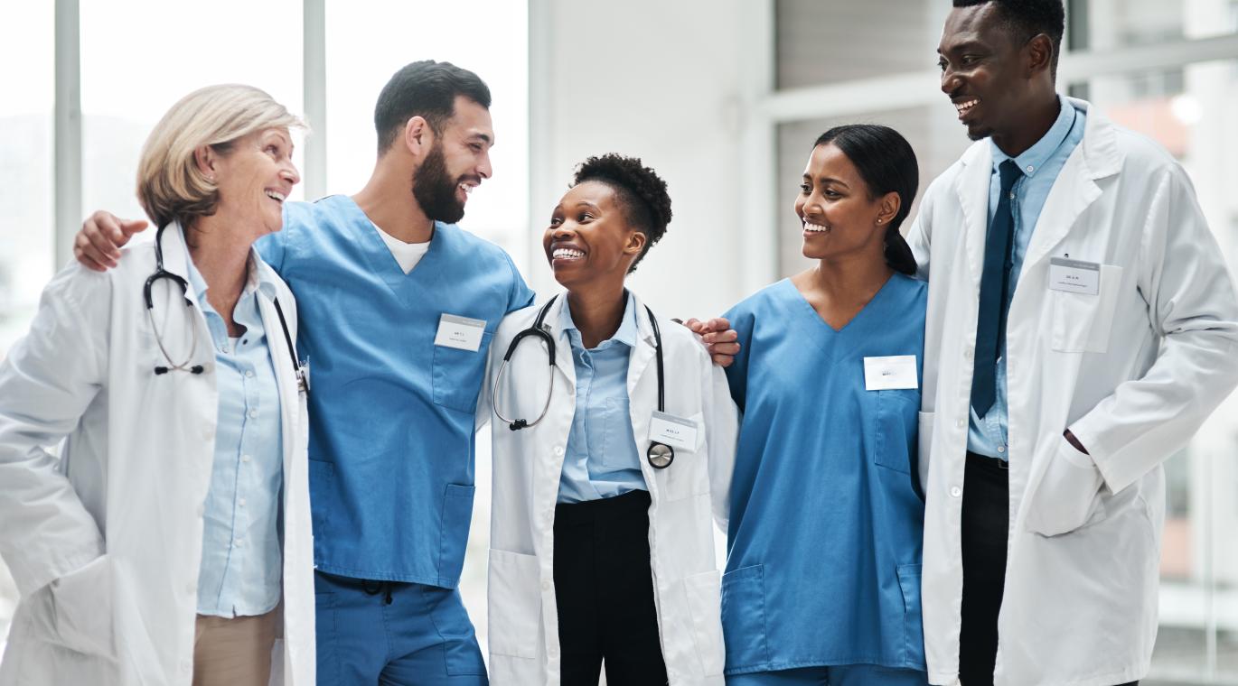 Group of physicians smiling at each other