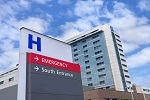 Photo of an H sign in front of a hospital