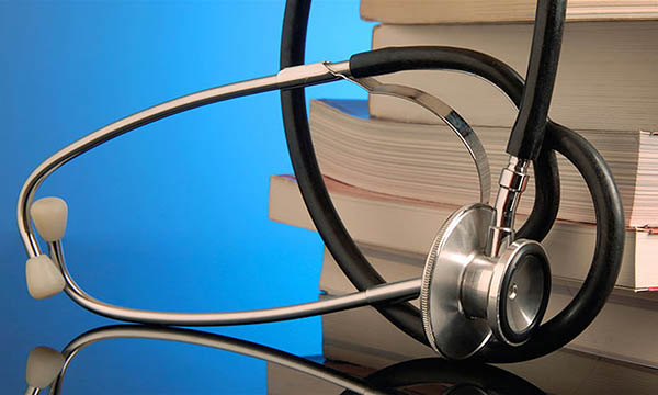photo of textbooks and stethoscope