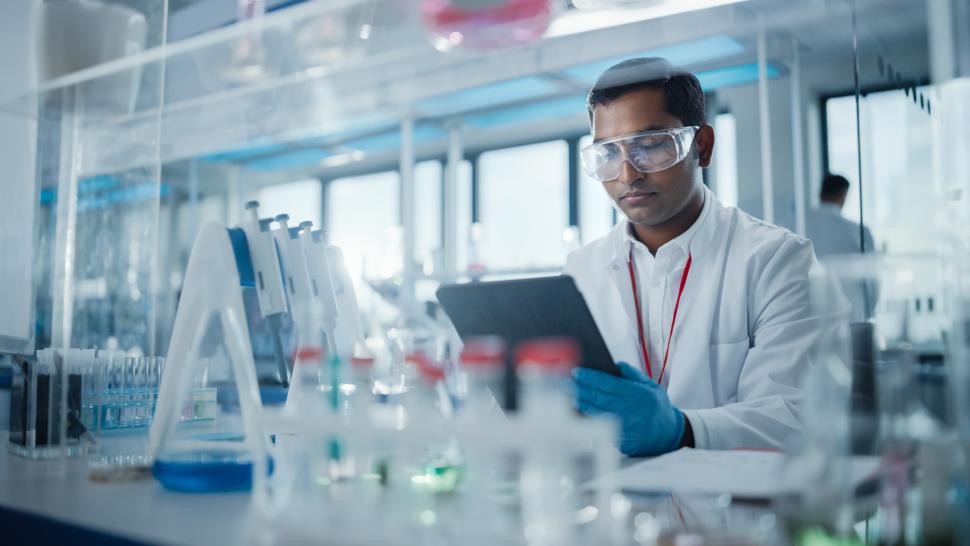 male physician reading in a lab