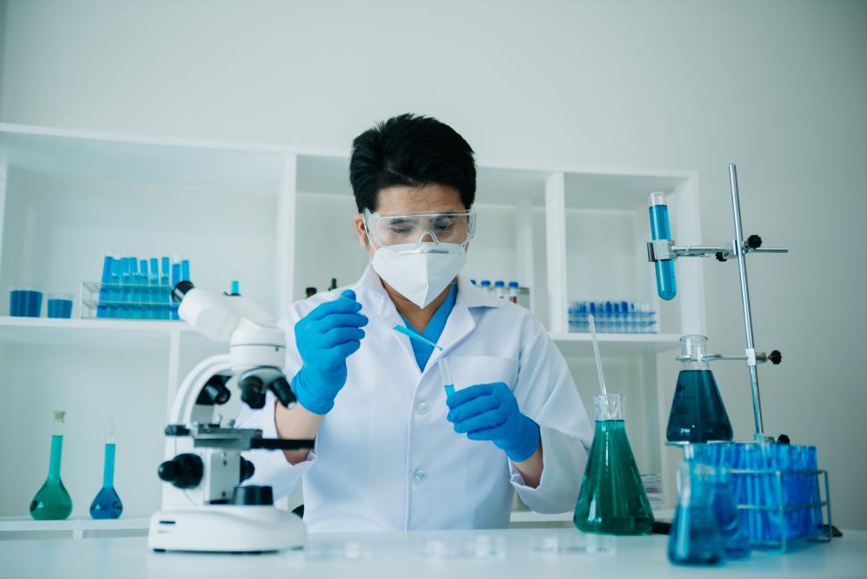 male physician working with test tubes in a lab