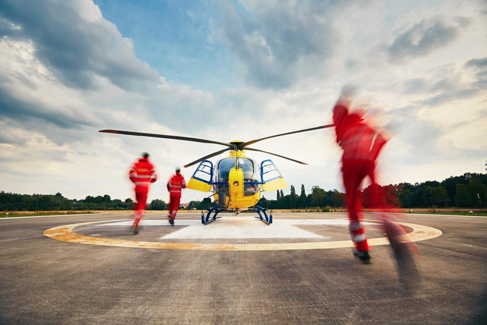 paramedics boarding medical helicopter for transport