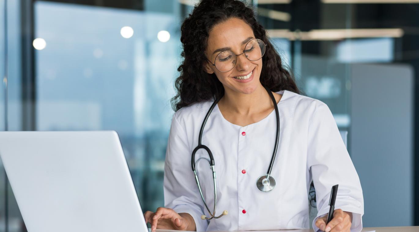 female physician using a laptop