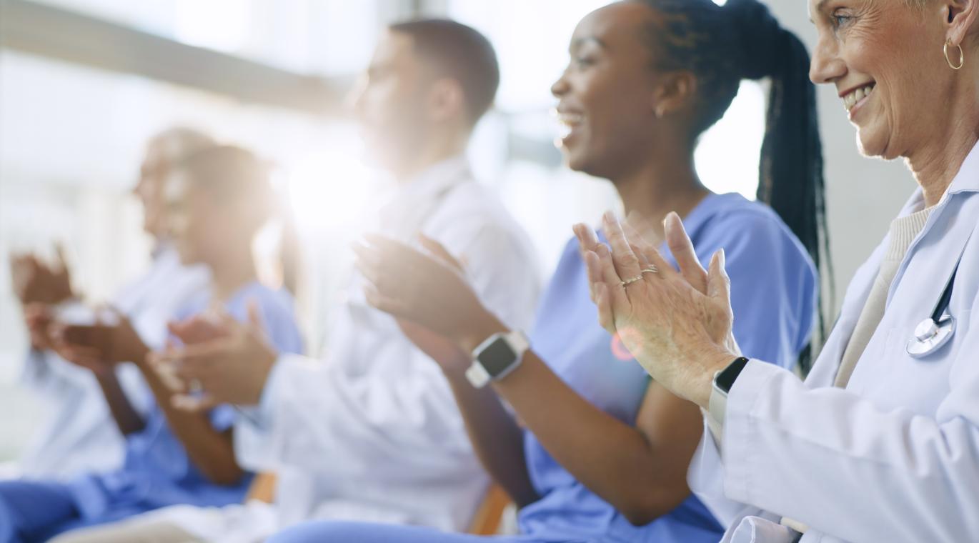 Doctors, happy and applause for celebration in conference with healthcare, presentation or medical results in hospital meeting or workshop. 