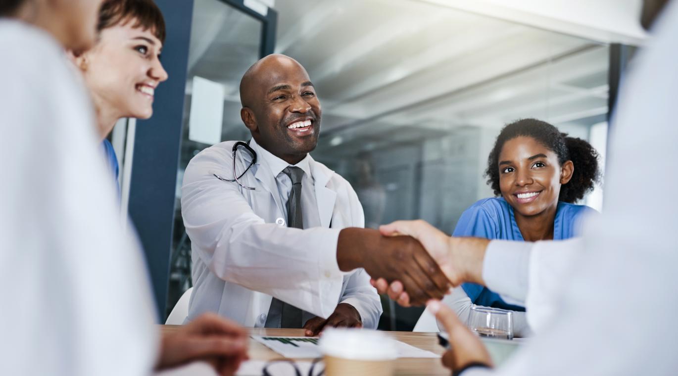 two physicians shaking hands