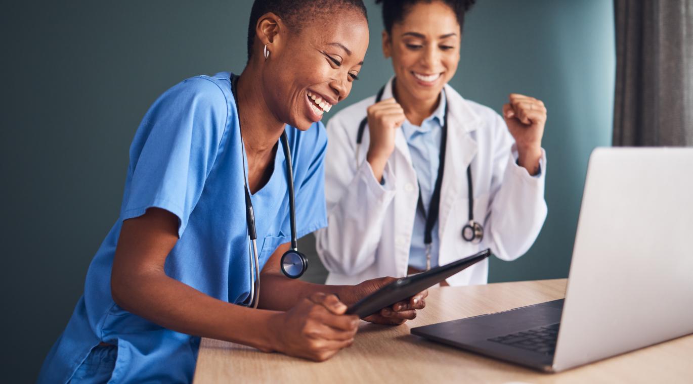 Laptop, black women or doctors in celebration of success for healthcare goals, achievement or hospital targets. 