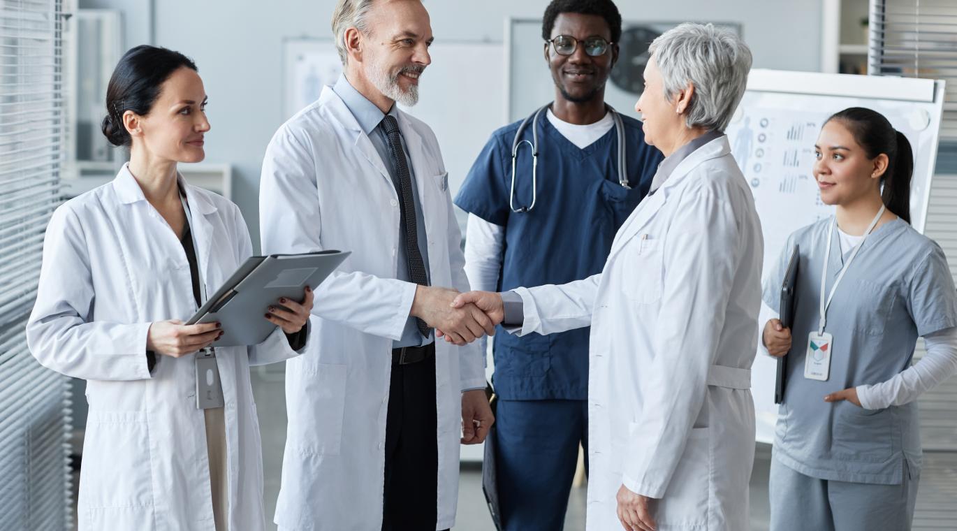 two physicians shaking hands