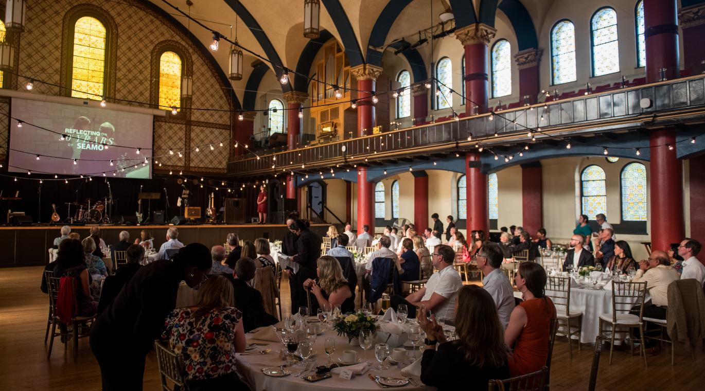 Room shot of guests sitting at their tables