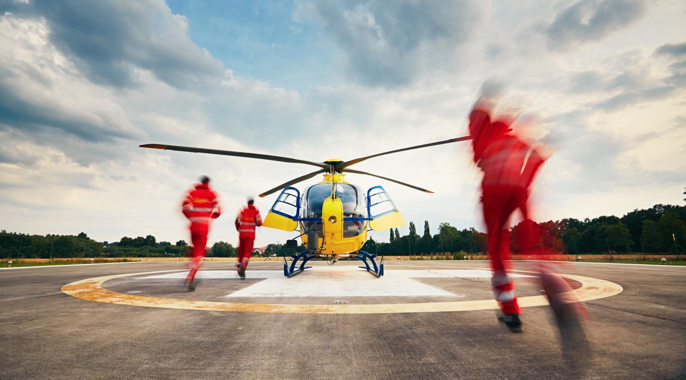 paramedics boarding medical helicopter for transport