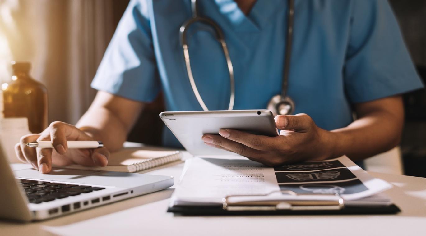 physician using a laptop