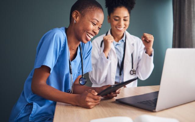 Laptop, black women or doctors in celebration of success for healthcare goals, achievement or hospital targets. 