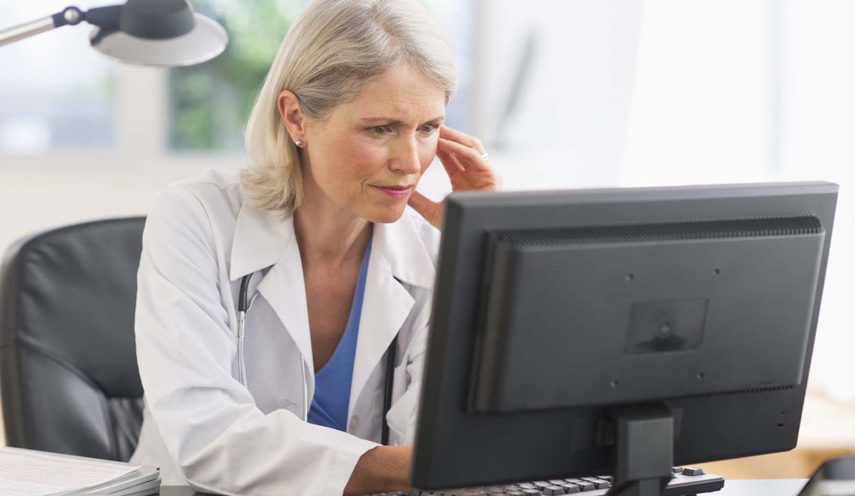 Female Physician on computer 