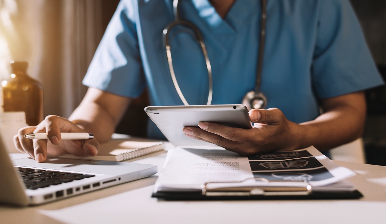 physician using a laptop