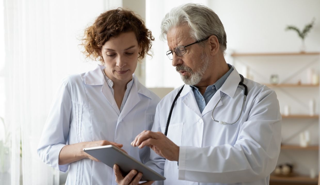 two physicians sharing a tablet